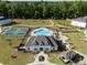 Aerial view of community amenities including playground, tennis court, and clubhouse with pool at 3747 Silvery Way, Powder Springs, GA 30127