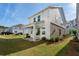 Backyard view of a covered patio and manicured lawn at 3747 Silvery Way, Powder Springs, GA 30127