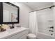 Bathroom features sleek vanity, framed mirror, and shower-tub combination at 3747 Silvery Way, Powder Springs, GA 30127
