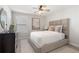 Well-lit bedroom features stylish decor, comfortable bed, and neutral color palette at 3747 Silvery Way, Powder Springs, GA 30127