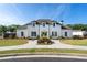 Exterior view of a clubhouse with benches and manicured lawn at 3747 Silvery Way, Powder Springs, GA 30127