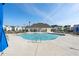 View of the community pool with lounge chairs and umbrellas at 3747 Silvery Way, Powder Springs, GA 30127