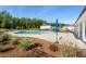 View of community pool with kiddie splash area and manicured landscaping at 3747 Silvery Way, Powder Springs, GA 30127