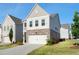 Charming two-story home with brick accents, inviting front yard, and attached garage at 3747 Silvery Way, Powder Springs, GA 30127
