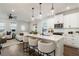 Modern kitchen featuring white cabinets, stainless appliances, and counter seating at 3747 Silvery Way, Powder Springs, GA 30127