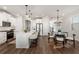 Well-lit kitchen features stainless steel appliances and an island with barstool seating at 3747 Silvery Way, Powder Springs, GA 30127