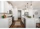 Modern kitchen featuring white cabinets, stainless appliances, and granite countertops at 3747 Silvery Way, Powder Springs, GA 30127