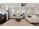 Comfortable living room featuring a fireplace, ample seating, and plenty of natural light at 3747 Silvery Way, Powder Springs, GA 30127