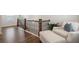 Comfortable living space with wood floors, stairs, and sitting area with natural light at 3747 Silvery Way, Powder Springs, GA 30127