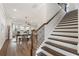 Bright open concept living room and staircase, perfect for gatherings and everyday comfort at 3747 Silvery Way, Powder Springs, GA 30127