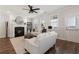 Cozy living room with a fireplace, neutral decor, and access to an outdoor area at 3747 Silvery Way, Powder Springs, GA 30127