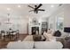 Inviting living room with a fireplace, comfortable seating, and large windows for natural light at 3747 Silvery Way, Powder Springs, GA 30127