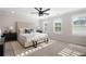 Spacious main bedroom featuring natural light, neutral tones, and ample space at 3747 Silvery Way, Powder Springs, GA 30127