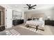 Bright main bedroom with large bed, ceiling fan, rug, and natural lighting at 3747 Silvery Way, Powder Springs, GA 30127