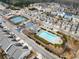 Community featuring a swimming pool and tennis court surrounded by well-maintained homes and landscaping at 3940 Village Estates Ct, Cumming, GA 30040