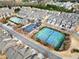 Community featuring a swimming pool and tennis court surrounded by well-maintained homes and landscaping at 3940 Village Estates Ct, Cumming, GA 30040
