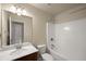 Bathroom features a sink, mirror, and shower/tub combo at 3940 Village Estates Ct, Cumming, GA 30040