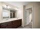 Bathroom featuring a double vanity, tile floors, and a doorway to a walk-in closet at 3940 Village Estates Ct, Cumming, GA 30040