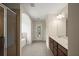 Bright and open bathroom with a tiled floor, shower, separate tub, and double vanity at 3940 Village Estates Ct, Cumming, GA 30040