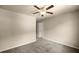 Comfortable bedroom featuring a ceiling fan, neutral walls, and plush carpet at 3940 Village Estates Ct, Cumming, GA 30040