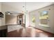 Dining room with hardwood floors, natural light, and view to backyard at 3940 Village Estates Ct, Cumming, GA 30040
