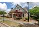 Charming clubhouse features a stone facade, arched entrance, and professionally landscaped grounds at 3940 Village Estates Ct, Cumming, GA 30040
