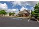 Elegant clubhouse entrance, surrounded by lush landscaping and convenient parking spaces at 3940 Village Estates Ct, Cumming, GA 30040