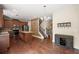 Open kitchen with granite counters and stainless appliances offers great entertaining space at 3940 Village Estates Ct, Cumming, GA 30040