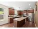 Stylish kitchen features granite countertops, stainless steel appliances, and a large island for meal preparation at 3940 Village Estates Ct, Cumming, GA 30040
