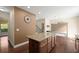 Open kitchen features a granite countertop island and stainless steel appliances at 3940 Village Estates Ct, Cumming, GA 30040