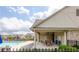 Poolside covered patio offers shaded seating and space to relax and enjoy the community amenities at 3940 Village Estates Ct, Cumming, GA 30040