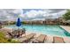 Community pool with ample seating and umbrellas, perfect for relaxation and recreation at 3940 Village Estates Ct, Cumming, GA 30040