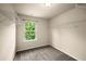 Spacious walk-in closet with carpet, a window, and wire shelving for ample storage at 3940 Village Estates Ct, Cumming, GA 30040