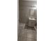 Bathroom features a vanity with mirror, tile floors, and neutral color scheme at 4185 Brookwood Dr, Austell, GA 30106