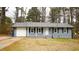 Charming single-story home with painted brick, black shutters, and an attached one car garage at 4185 Brookwood Dr, Austell, GA 30106