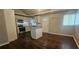 Spacious kitchen with island, white cabinets, stainless steel appliances, and hardwood flooring at 4185 Brookwood Dr, Austell, GA 30106