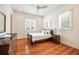 Comfortable bedroom with hardwood floors, neutral decor, and ample natural light for a tranquil space at 4835 Merlendale Ct, Atlanta, GA 30327