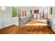 Hallway with hardwood floors, white walls, and staircase leading to other floors in the house at 4835 Merlendale Ct, Atlanta, GA 30327