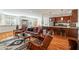 Open-concept living area showcasing hardwood floors, kitchen view, and traditional decor elements at 4835 Merlendale Ct, Atlanta, GA 30327