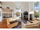 Spacious living room features a large fireplace, built in bookcase and vaulted ceilings at 4835 Merlendale Ct, Atlanta, GA 30327