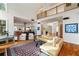 Bright living room with high ceilings, hardwood floors, modern furniture and a glimpse into the open-plan kitchen at 4835 Merlendale Ct, Atlanta, GA 30327