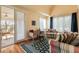 Inviting sitting room featuring a desk, comfortable seating, and access to an outdoor porch, offering relaxation and functionality at 4835 Merlendale Ct, Atlanta, GA 30327