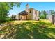 A spacious backyard with a two story deck and ample green space perfect for outdoor enjoyment at 1010 Augusta Woods Dr, Douglasville, GA 30134