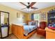 Cozy bedroom with neutral tones, natural light, and a ceiling fan at 1010 Augusta Woods Dr, Douglasville, GA 30134