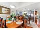 Warm dining area adjacent to the kitchen, featuring a wood table, chairs, and ample natural light at 1010 Augusta Woods Dr, Douglasville, GA 30134