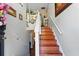 Inviting foyer featuring a staircase with wood steps, white risers, and decorative floral accents at 1010 Augusta Woods Dr, Douglasville, GA 30134