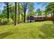 Large, well-maintained backyard with lush green grass and mature trees at 1541 Pontiac Se Pl, Atlanta, GA 30315