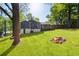Expansive backyard with a fire pit and lush greenery at 1541 Pontiac Se Pl, Atlanta, GA 30315