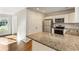 Bright kitchen with stainless appliances and granite countertops near living area at 1541 Pontiac Se Pl, Atlanta, GA 30315