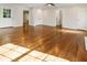 Spacious living room with newly refinished hardwood flooring and abundant sunlight at 1541 Pontiac Se Pl, Atlanta, GA 30315